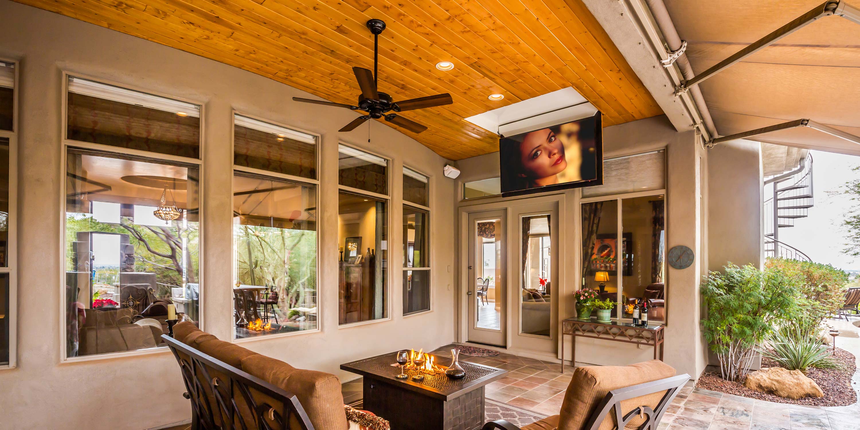 outdoor covered porch with tan walls and wooden ceilings