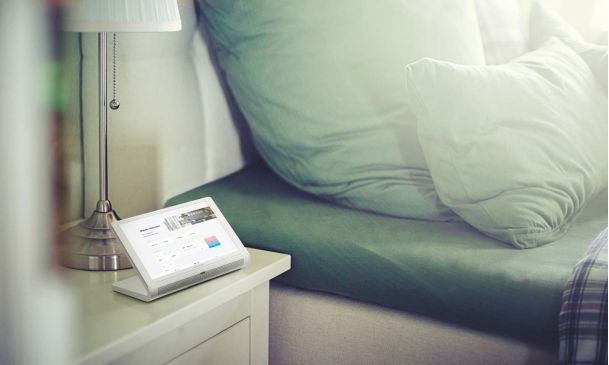 Crestron touchpanel next to bedding