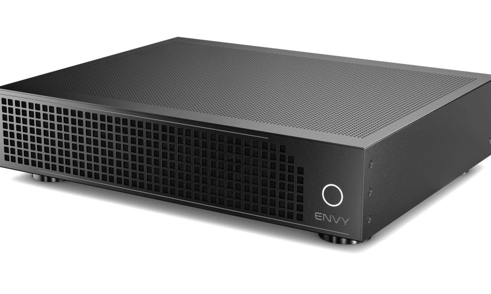 KEF speakers in white on wooden table