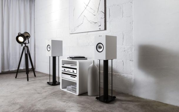 White Kef speakers in modern rustic home