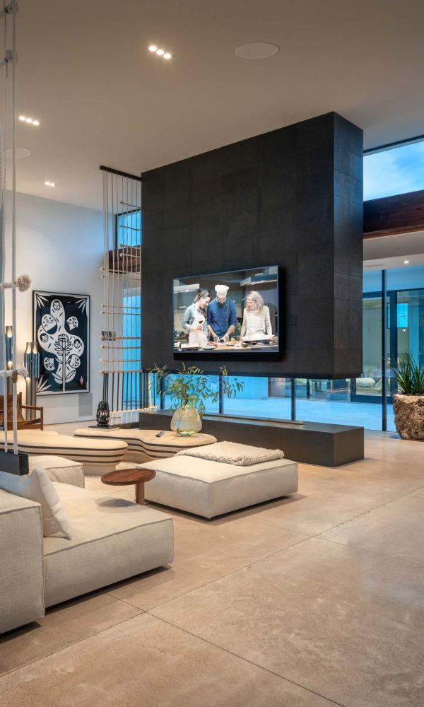 smart home technology with crestron touchpad next to bed