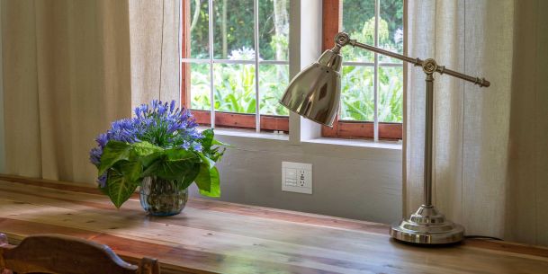Gold lamp on wooden desktop