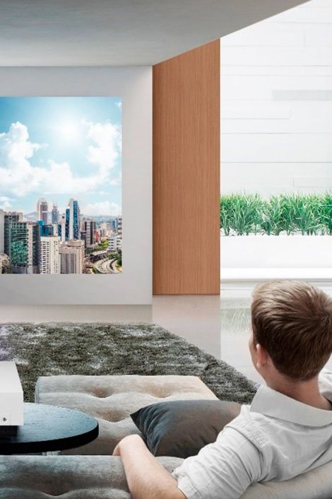 Man watching tv in home theater